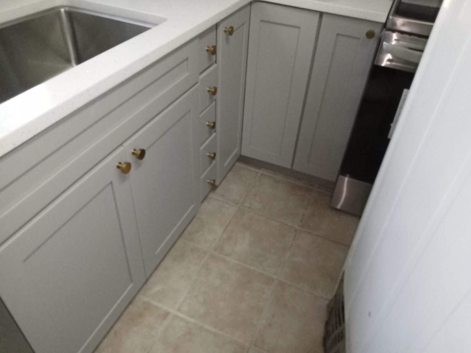 After: new gray shaker base cabinets and drawers