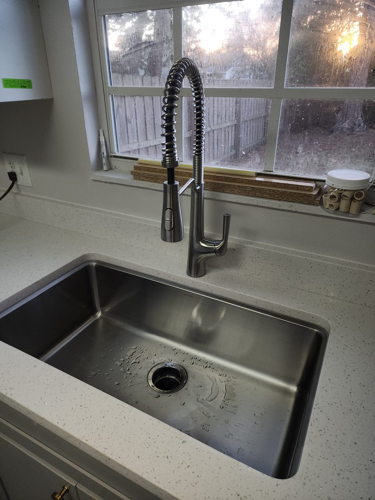 After: new stainless undermount sink, pull-down faucet and quartz countertop
