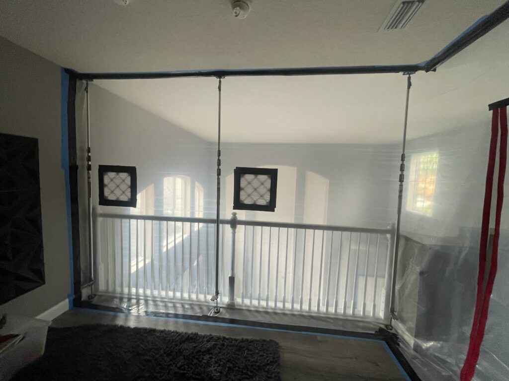 Plastic containment barrier sealing off the work area