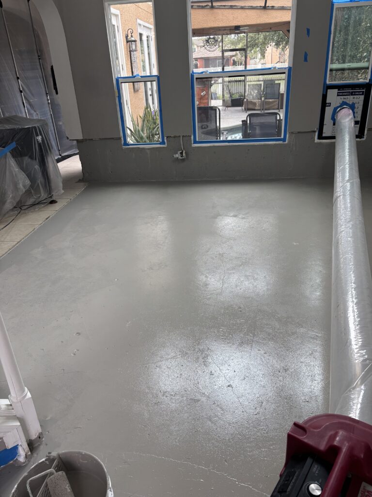 Cleaned subfloor across the living room after remediation