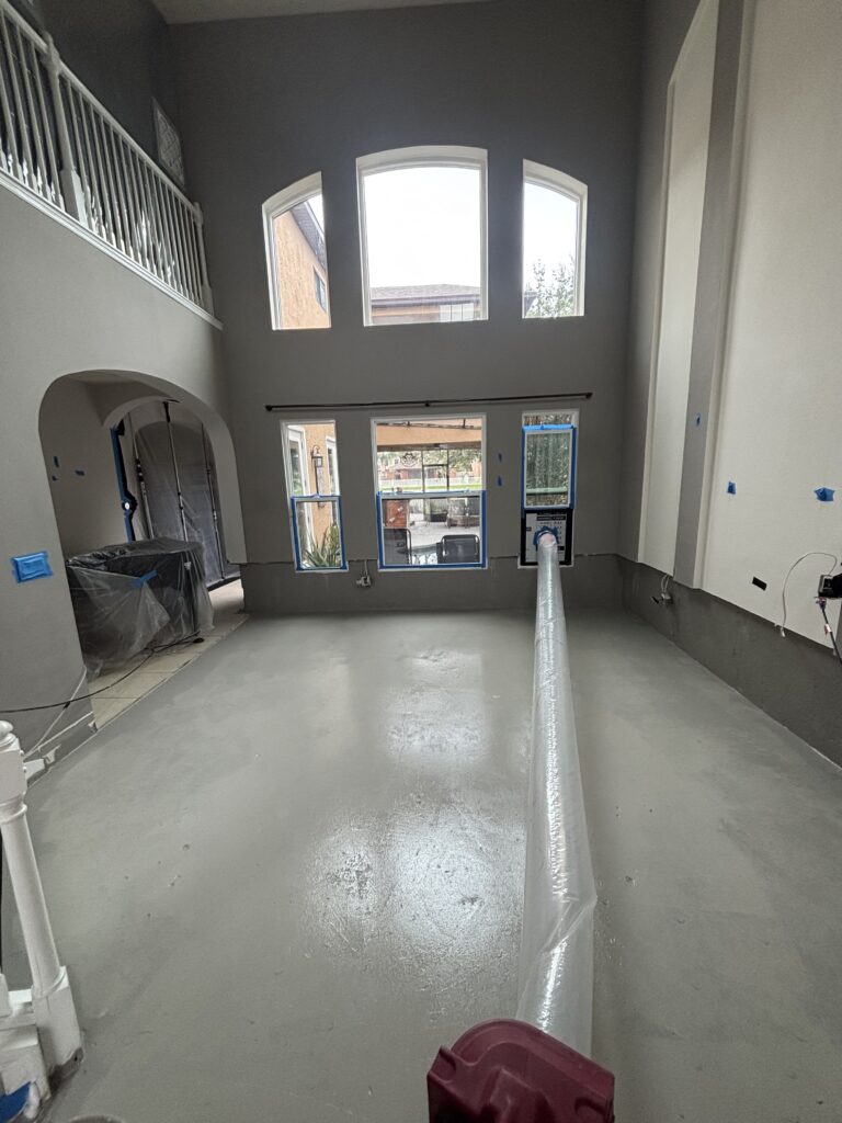 Living room cleared and cleaned after mold remediation, ready for rebuild